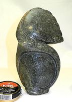 Front view of sculpture with Kiwi shoe polish container for scale