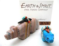 Photo showing both bear fetishes with 'Earth to Spirit Fair Trade Company' leaflet in background.