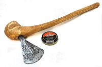 Long view of the full Batonka axe showing the wooden handle and steel blade with a tin of Kiwi shoe polish for scale and context.