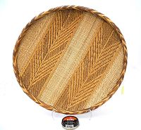 Top down view showing the intricate weaving patterns and broad flat shape.