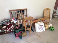 Photo showing a 24x30 inch window pane mirror, handcrafted wooden shelf, small heart-shaped wooden table, Christmas wreath with Santa figurines, record albums and soccer balls placed on floor.