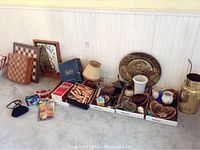 Overview of items including checkerboards, wall clock, brass plate, lamp, and various boxes