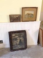 Three framed pictures displayed: a watercolour cottage scene with broken glass, black and white mountain photo, and sailboats picture with poor condition frame.