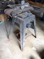 Front view of Sears belt sander showing metal stand and sanding belt area.