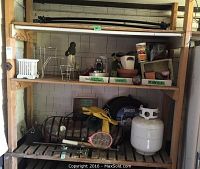 Overview of shelves with assorted auto and garden items