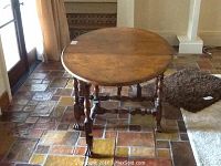 Oval gate leg table in open position showing oval top and legs