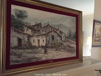 Full view of framed painting titled 'Mino' depicting a rustic mountain village with a figure carrying wood.