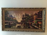 Full view of the framed street scene artwork showing the entire scene and the ornate frame.
