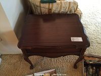 Top front angled view of the Dielcraft side table showing the dark stained scalloped edge wood top and cabriole legs.