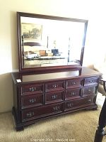 Full front view of dresser and mirror showing overall appearance and finish