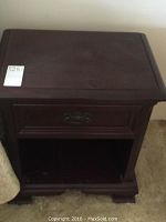 Full view of the solid mahogany night stand showing drawer and open shelf.