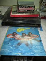 Photo of Technics SL-QD33-1 record player with The Monkees 'Pool It!' vinyl album on the table in front, showing the player and part of the record collection behind.