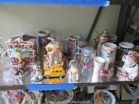 Shelf with assorted steins, dog figurines, ceramic items and novelty collectible items.