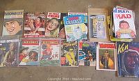 Full overview of collectible comic books including Mad, Ace Comics, Spider Man, Fantastic Four, Vampirella, Ken, and vintage magazines.