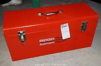 Closed red Ridgid Kollmann metal case with handle and latches