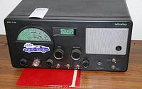 Front view of the Hallicrafters Model S-40A radio receiver showing tuning dial, knobs, switches, and speaker grille with branding.