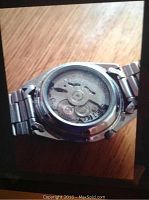 Back view of Seiko watch showing automatic movement through transparent case back.