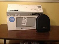 SoundDock box and headphone case displayed side by side