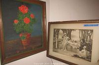 Signed painting of red geranium flowers in a pot with dark background and green frame
