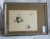 Full view of framed panda art work in wooden frame on white background.