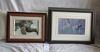 Both framed nature prints together show a squirrel on left and cardinal on right, framed in wood with mats.