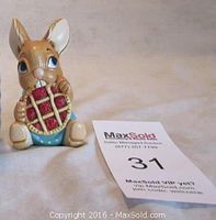 Front view of Pendelfin Picnic Midge ceramic rabbit figurine holding a red pie next to a lot number card.