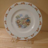 Full view of Royal Doulton Bunnykins plate showing rim pattern and central bunny scene.