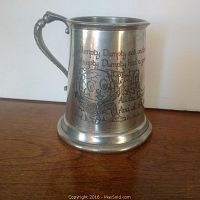 Front view showing Humpty Dumpty nursery rhyme engraved into the side with accompanying illustrations.