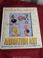 Front cover of the Warner Bros. Animation Art Limited Edition book showing main cartoon characters and Warner Bros. logo