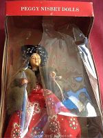 Front view of Peggy Nisbet collector doll Katherine of Aragon in original box with clear protective plastic cover, showing full figure and costume details.