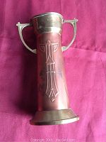 Full view of copper and brass Vienna Secessionist vase showing front embossed design and handles.