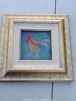 Front view of the framed square glass tile with a rooster image, showcasing the details of the frame and artwork.