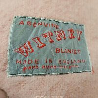 Close up image of the blanket label showing the brand and origin details.