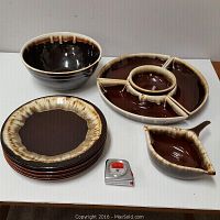 Full set including chip and dip dish, gravy boat, four plates, mixing bowl, with a measuring tape for scale.