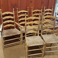 Set of 6 vintage ladder back chairs, 2 with arms and 4 without, showing overall condition and woven seats.