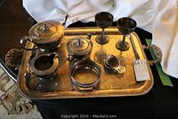 Full view of 1881 Rogers silverplate tea service pieces on ornate Rogers tray including teapot, sugar bowl, creamer, two goblets, butter ring, spoon, and knife.