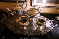 Full view of the Victorian silverplated tea and coffee set on the serving tray showing all five pieces.