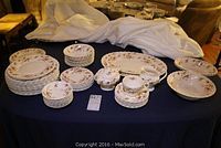 Full display of Myott china set arranged on a table with plates, bowls, platters, cup, saucers, cream and sugar set