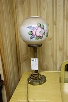 Full view of the entire vintage lamp showing base, stem, and floral glass shade