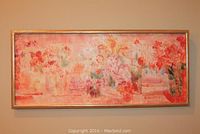 Full view of the horizontal rectangular encaustic painting featuring floral forms in pink, red, orange, and green. Framed in a gold-tone frame showing wear.