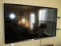 Front view of mounted Sharp Aquos Quattron TV