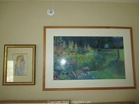 Two framed artworks on wall: smaller woman and child pastel on left and larger garden scene pastel on right.