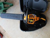 Poulan Pro chainsaw inside the open carrying case, showing the blade cover and body of saw.