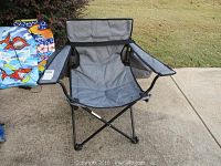 Single silver folding lawn chair with gray fabric, armrests, and carrying bag