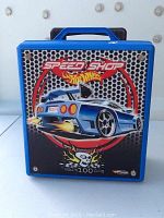 Front of blue Hot Wheels Speed Shop plastic carrying case featuring car graphic
