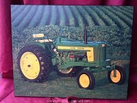 Front view of the vintage John Deere tractor picture mounted on board, showing the tractor in a field with details of the photo and mounting visible.