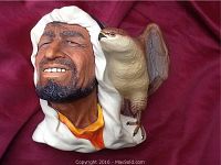 Front angled view showing nomad man's detailed facial expression and falcon on shoulder