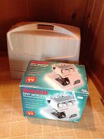 Photo showing the Singer Tiny Serger Model TS 380A in original retail box with carrying case behind it.