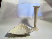 Front view of Lenox bud vase and triangle shaped candy dish with embossed floral patterns and gold trim