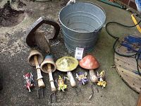 Photo showing four ceramic bobble mushrooms in front of a galvanized bucket, with fairy door nearby and four fairy shelf sitters in front.